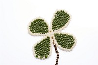  Clover bead jewelry white background. AI generated Image by rawpixel.