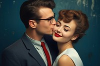 Woman with blue earring kissing portrait smiling adult.