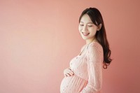 Pregnant asian woman smiling adult anticipation.