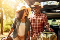Middle age African american couple vacation vehicle luggage.