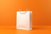 Paper bag  handbag orange background celebration.