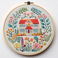 The house in embroidery style needlework textile pattern.