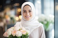 A happy Middle east woman flower shop owner adult bride smile.