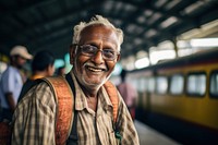 Elderly South Asian man train portrait glasses.