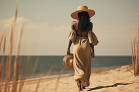 African black woman walking summer beach.