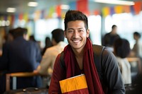 Bhutanese man with passport smiling adult smile.