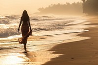 Sri Lankan women walking beach sunlight.