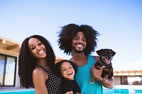 Black family and someone holding puppy laughing swimming mammal.