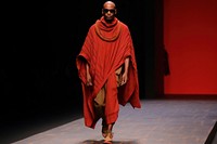 An african man model on fashion runway performance performer portrait.