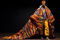 An african man model on fashion runway tradition performer headwear.