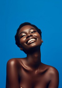 A black woman smile with navy eye shadow photography portrait fashion.