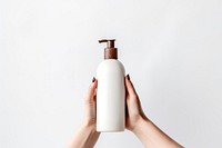 Cosmetic bottle cosmetics holding hand.