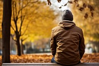 Anxiety sitting autumn bench. AI generated Image by rawpixel.