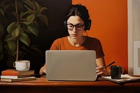 Woman working from home computer glasses sitting.