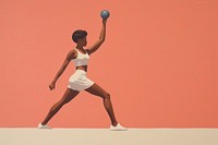 Black woman playing with dumbell throwing adult determination.