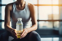 Woman hands in sport wear holding sport water drink sitting bottle sports. AI generated Image by rawpixel.