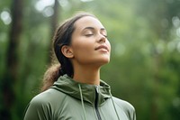 Woman in sport wear breathing fresh air portrait sports adult. 