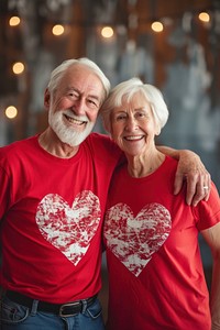 Couple senior wearing heart-shaped matching shirts smiling t-shirt adult.