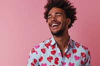 Wearing heart-shaped matching shirts laughing smiling smile.