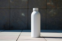 A blank white large wide mouth water bottle  cylinder architecture refreshment.