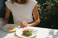 A happy woman dining in the garden plate adult food. AI generated Image by rawpixel.