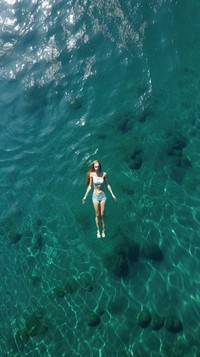 Blue sea swimming swimwear outdoors. AI generated Image by rawpixel.
