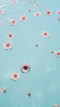  Pastel flowers floating swimming outdoors. AI generated Image by rawpixel.