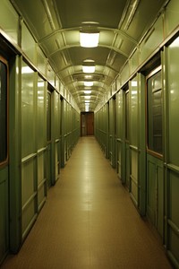 Empty corridor in old train architecture illuminated punishment.