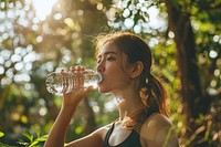 Workout lady drinking water outdoors bottle refreshment. 