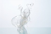 Liquid water forming of shape glass transparent splattered.