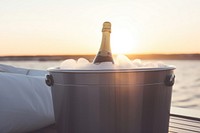 Champagne outdoors sunset bucket. AI generated Image by rawpixel.