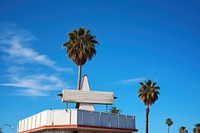 Blank white retro 1960s restaurant sign in california sky architecture building.