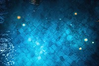 Glowing lights reflecting on water surface night backgrounds swimming.