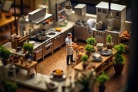 Chef in kitchen tilt-shift toy countertop. 