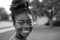 Black teenager self-portrait confident smile.