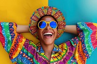 Cool senior black man with fashionable clothing style portrait on colored background sunglasses laughing adult.