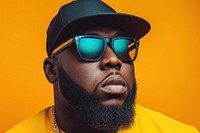 Cool young black man with fashionable clothing style full body on colored background sunglasses portrait beard.