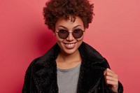 Cool young black woman with fashionable clothing style full body on colored background laughing portrait adult.
