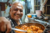 Indian father cooking food smiling freshness.