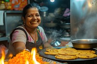 Indian female chef food smiling cooking.
