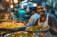 Indian waiter serving food smiling adult.