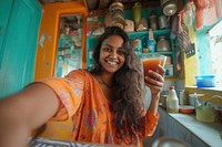 Indian girl making portrait smiling selfie.