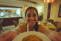 Indian hotel waitress serving food restaurant portrait.