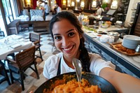 Indian hotel waitress serving food restaurant smiling.