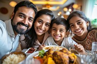 Indian family dinner food smiling adult.