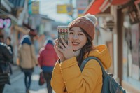 Korean vlogger live on street photo phone photographing.