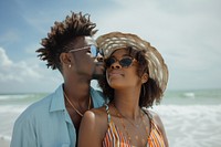 Two Afican American at the beach together photography sunglasses swimwear.