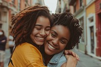Two happy beautiful young African American gay laughing hugging smile.