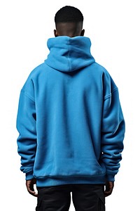 A man in jeans looking up on a white background isolation back view sweatshirt hood architecture.