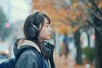 Japanese student listening music headphones headset photo.